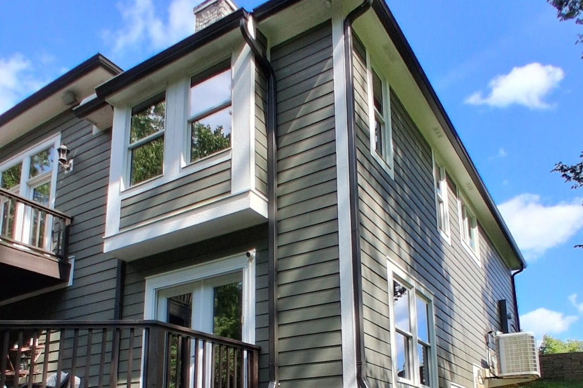 A continuous run of seamless gutter along the full length of a two story home, with no joints between the corners.